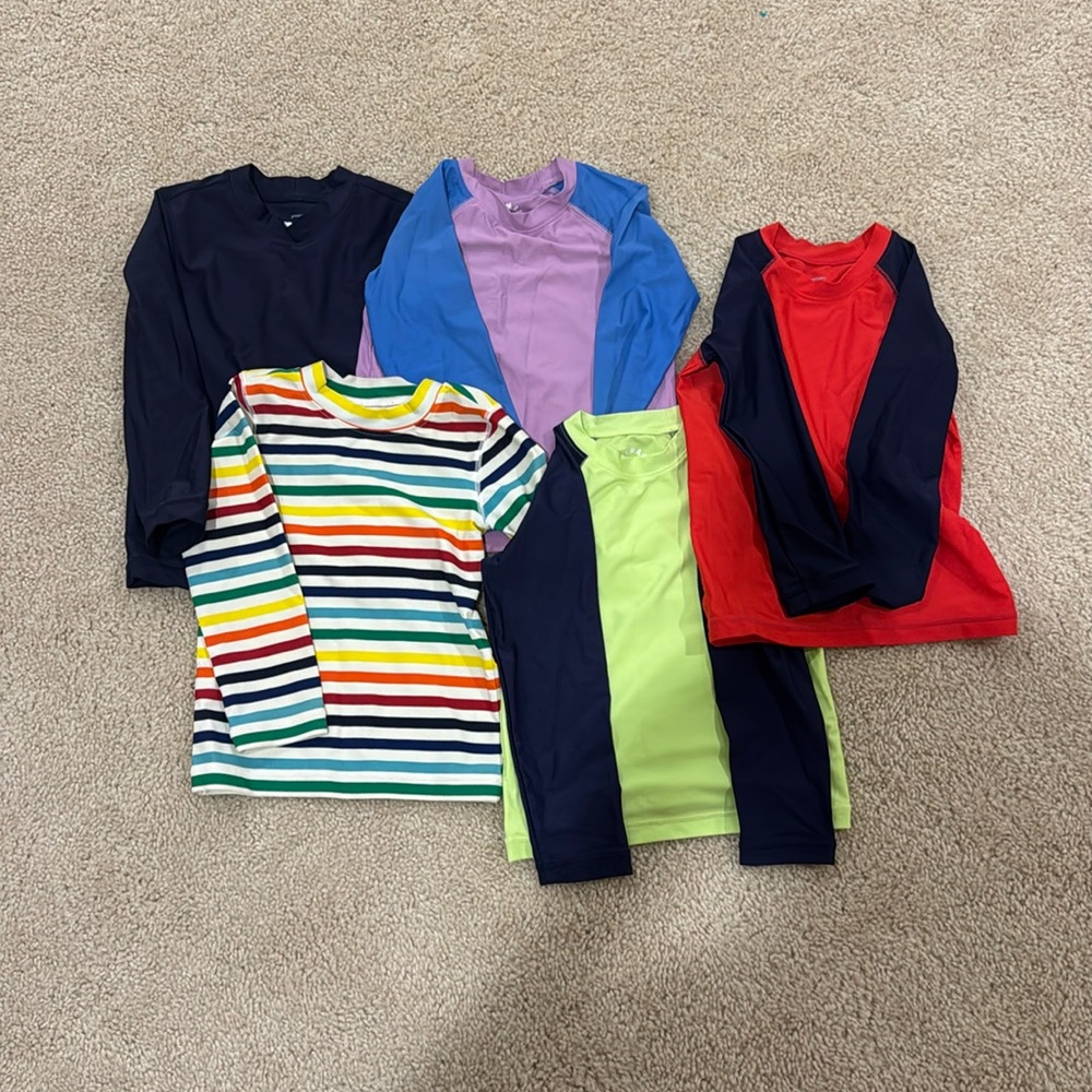 Five long sleeve rash guards